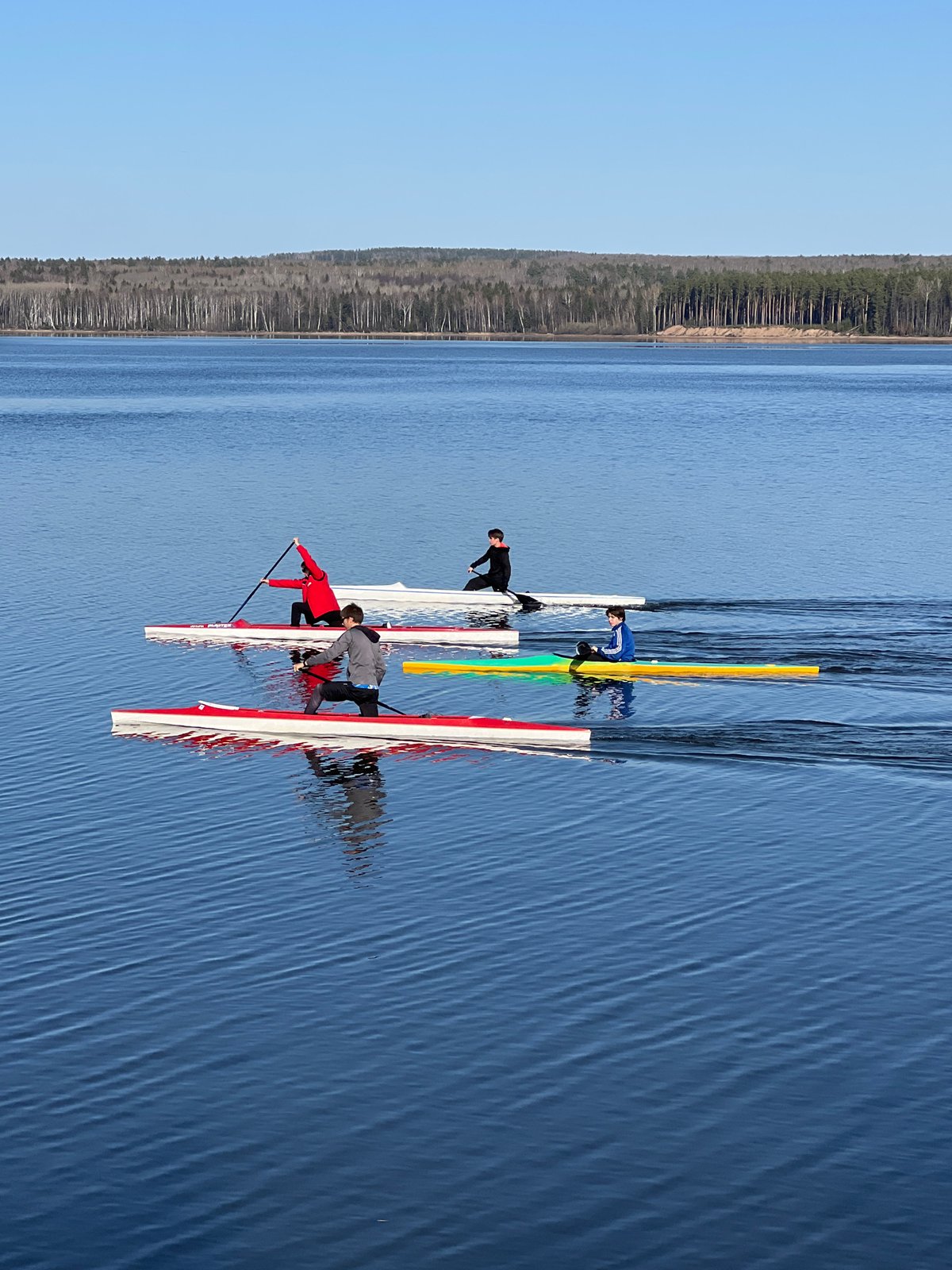 Kayakers and rowers enjoy sunny afternoon at Chaikovsky lakefront