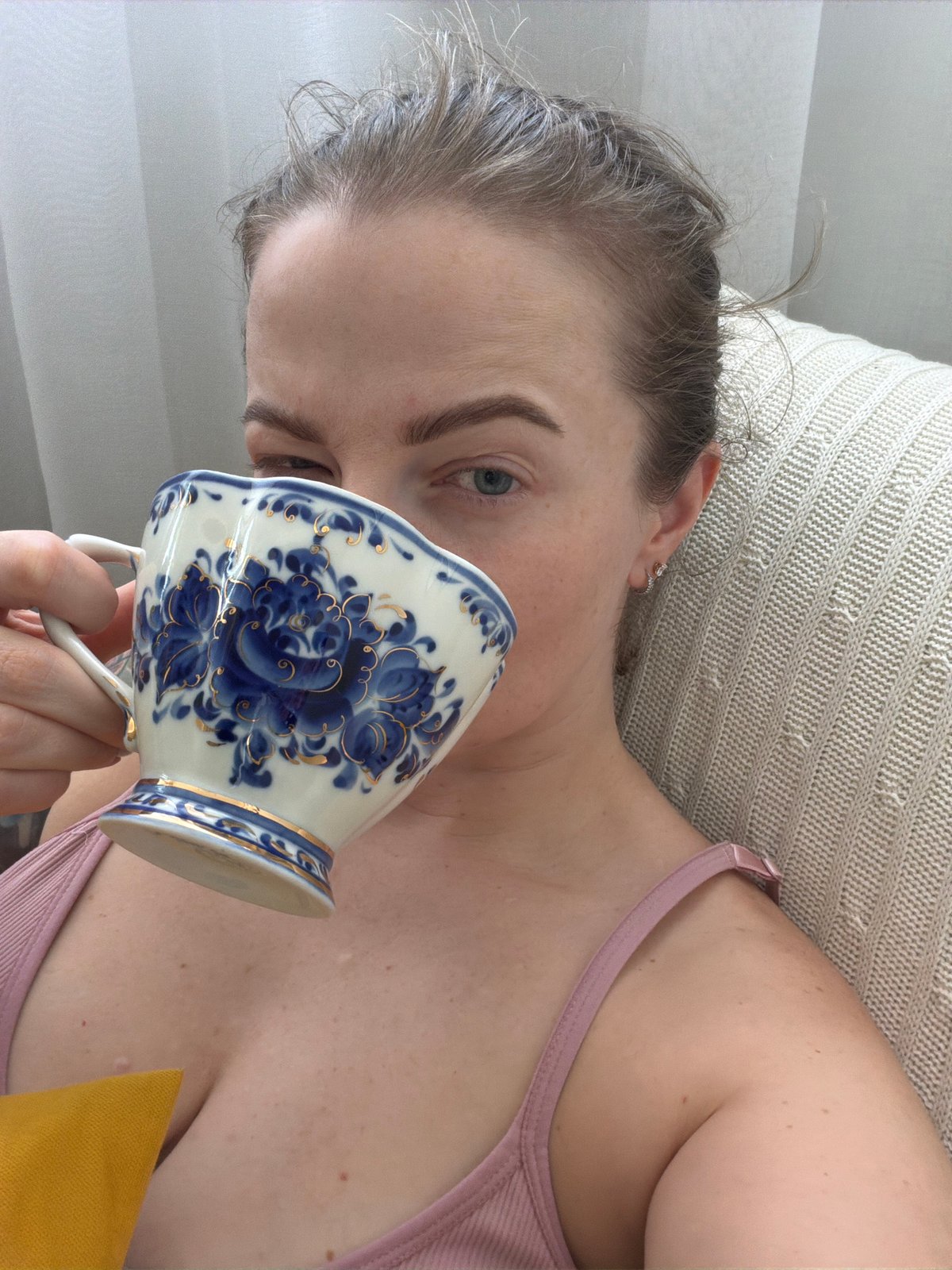 Person enjoys traditional tea moment indoors in Moscow