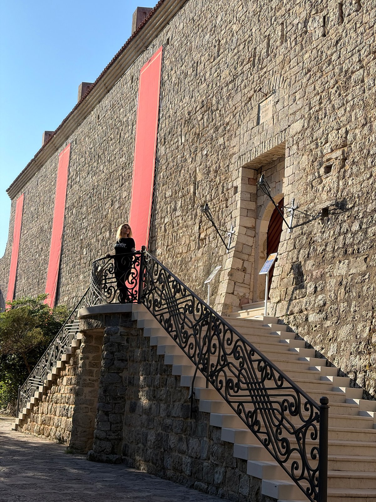 Tourist documents morning visit to historic Budva, Montenegro locations