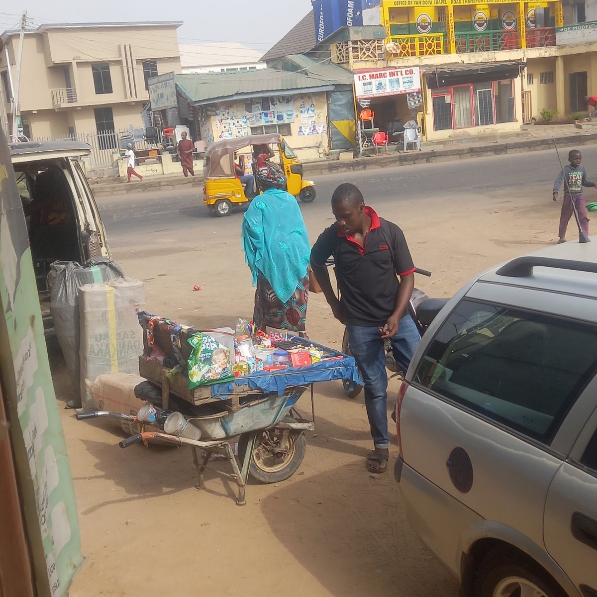 Morning street life documented in Nigerian commercial districts