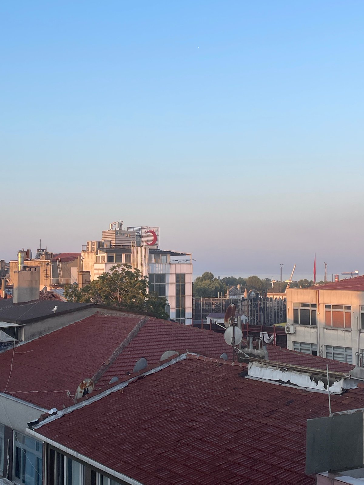 Kadıköy rooftop at dawn, Bosphorus and old streets below