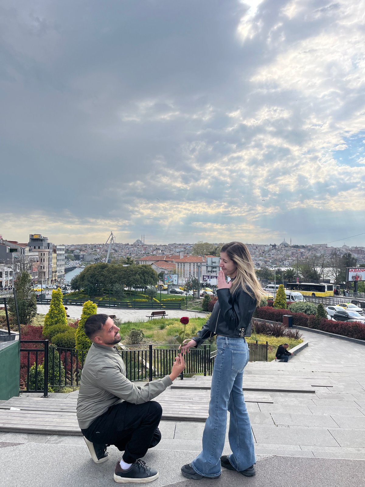 Couple shares romantic moment on Beyoğlu overlook amid cityscape photography