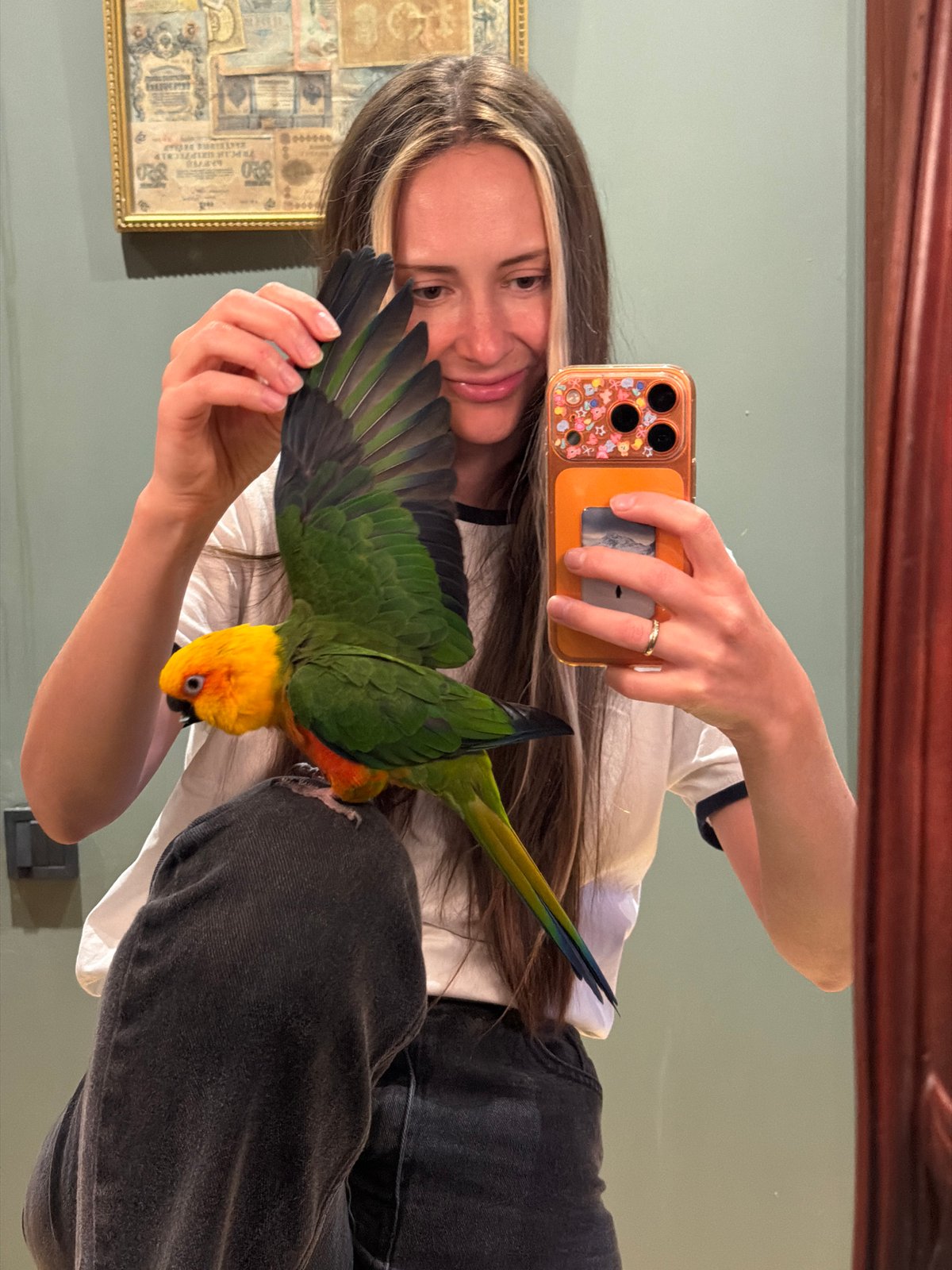 Woman documents spring afternoon with pet parrot in Khimki