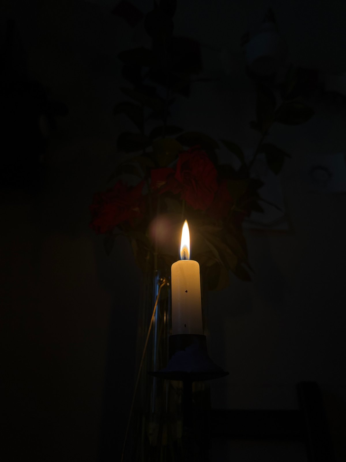 Quiet domestic moment captured in Moscow kitchen with candle