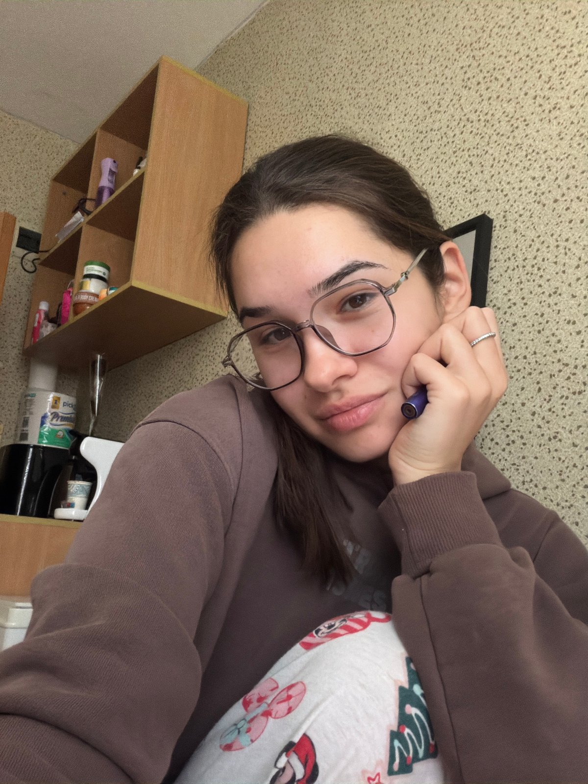 Young woman takes casual selfies indoors in Sofia