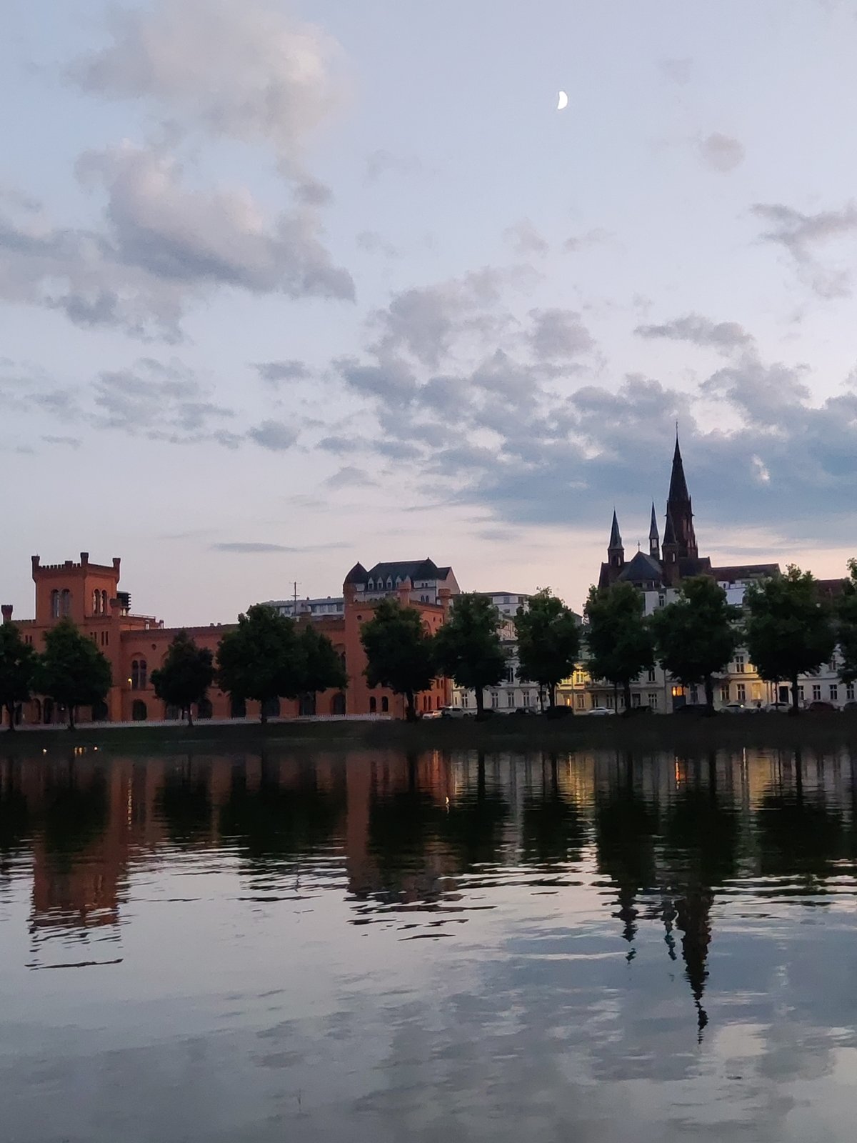 Dusk along Schwerin's lakes — swans, castle reflections, city details