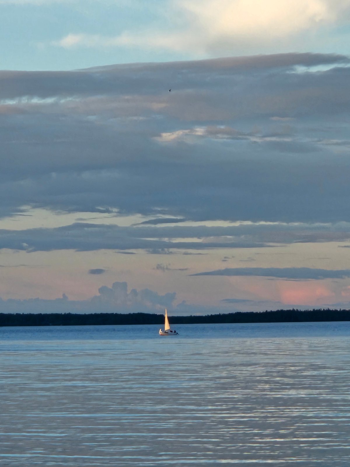 Calm waters and blue-domed churches at golden hour