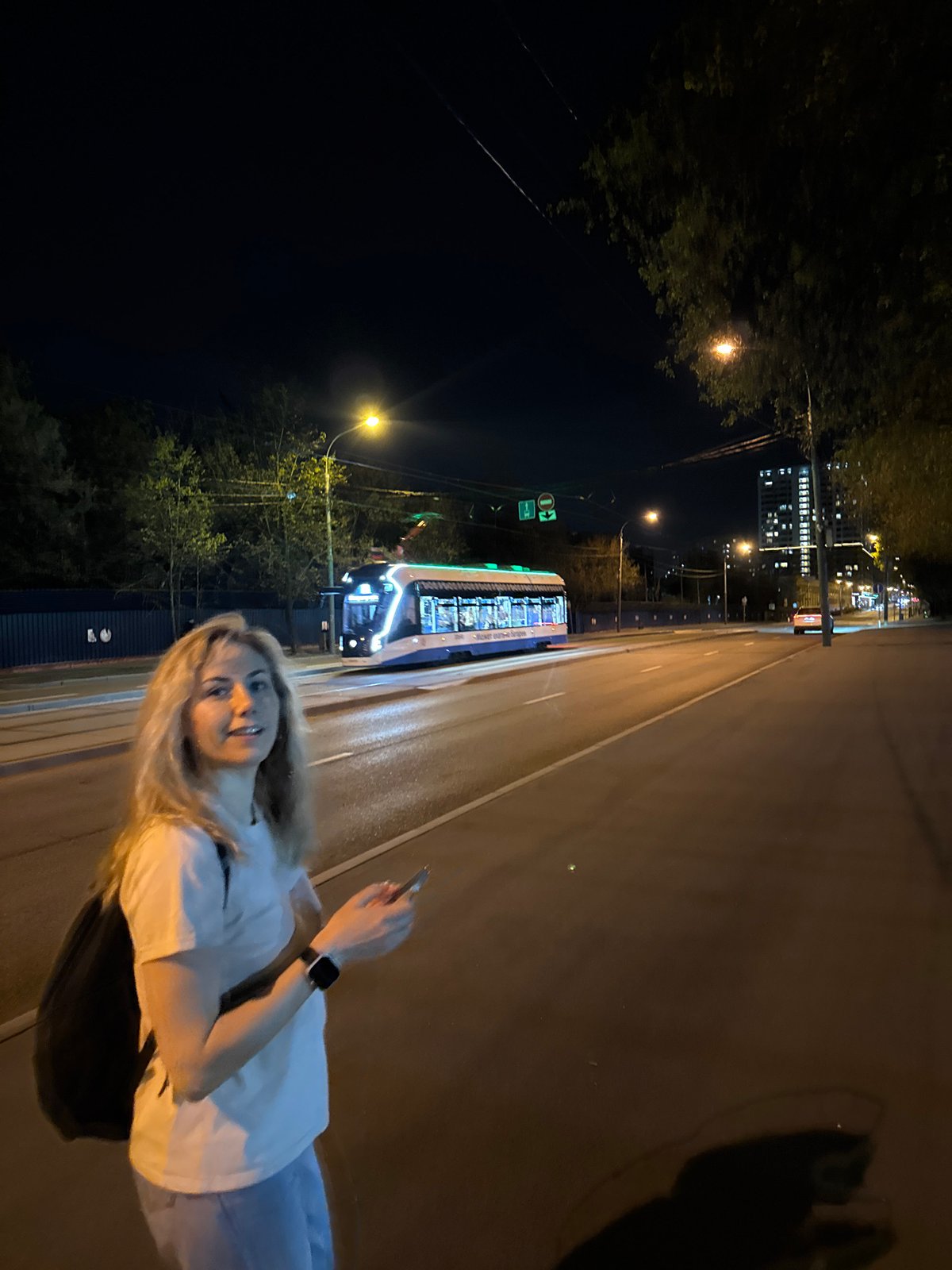 Nighttime scenes captured across Moscow show people, architecture