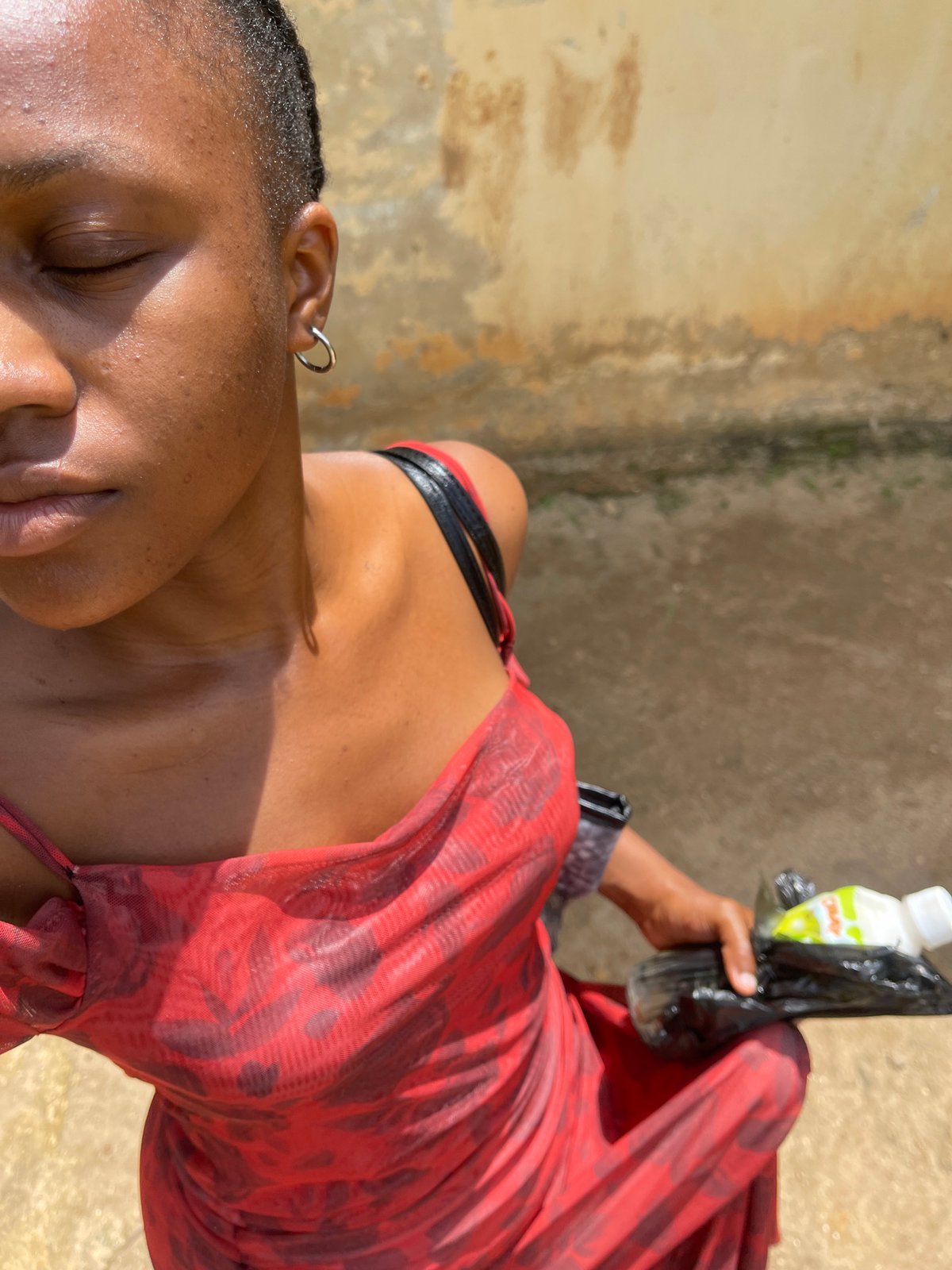 Everyday scenes along a dirt path in Rafin Par, Nigeria