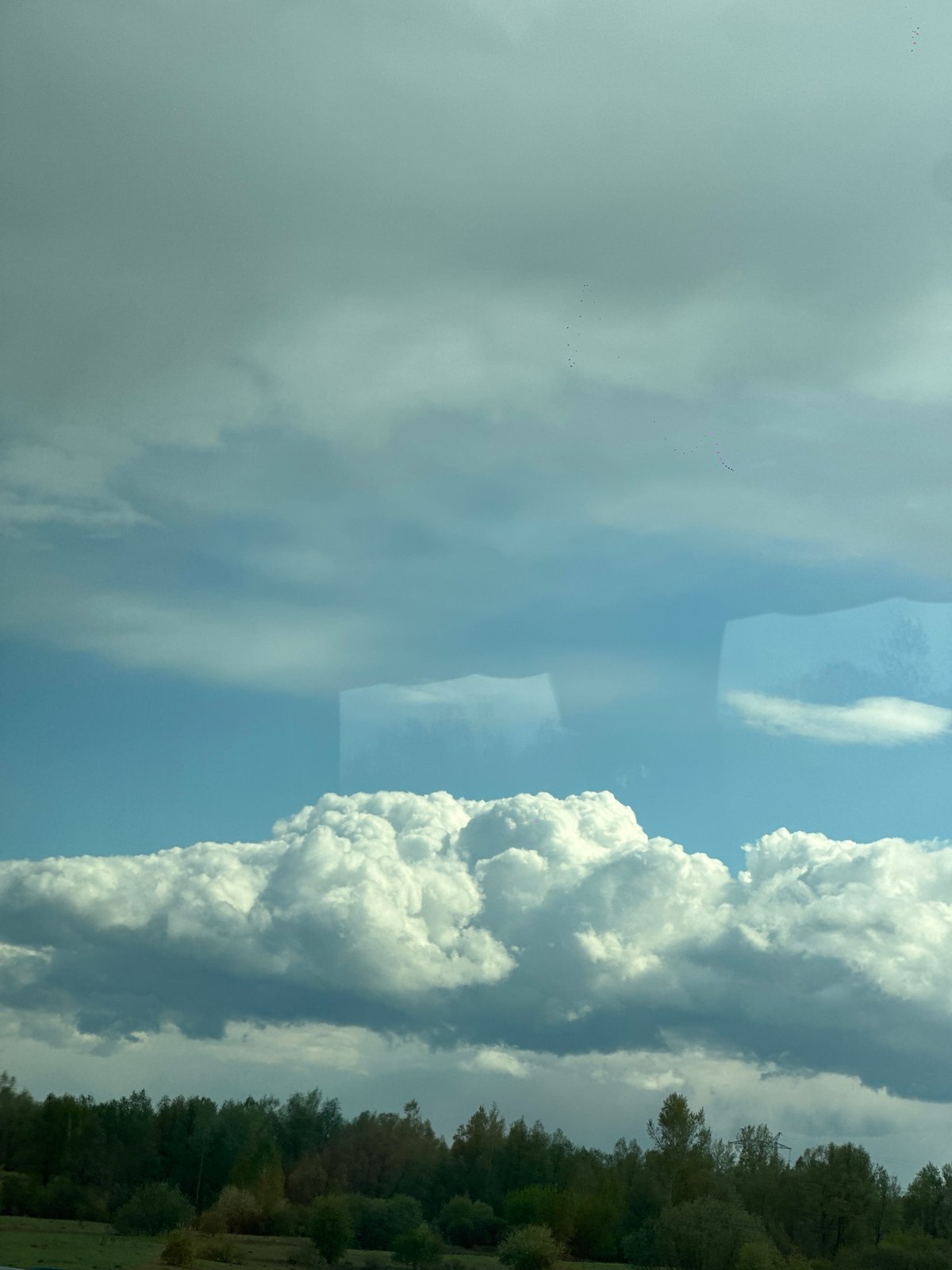 Cumulus clouds observed over rural Russia landscape