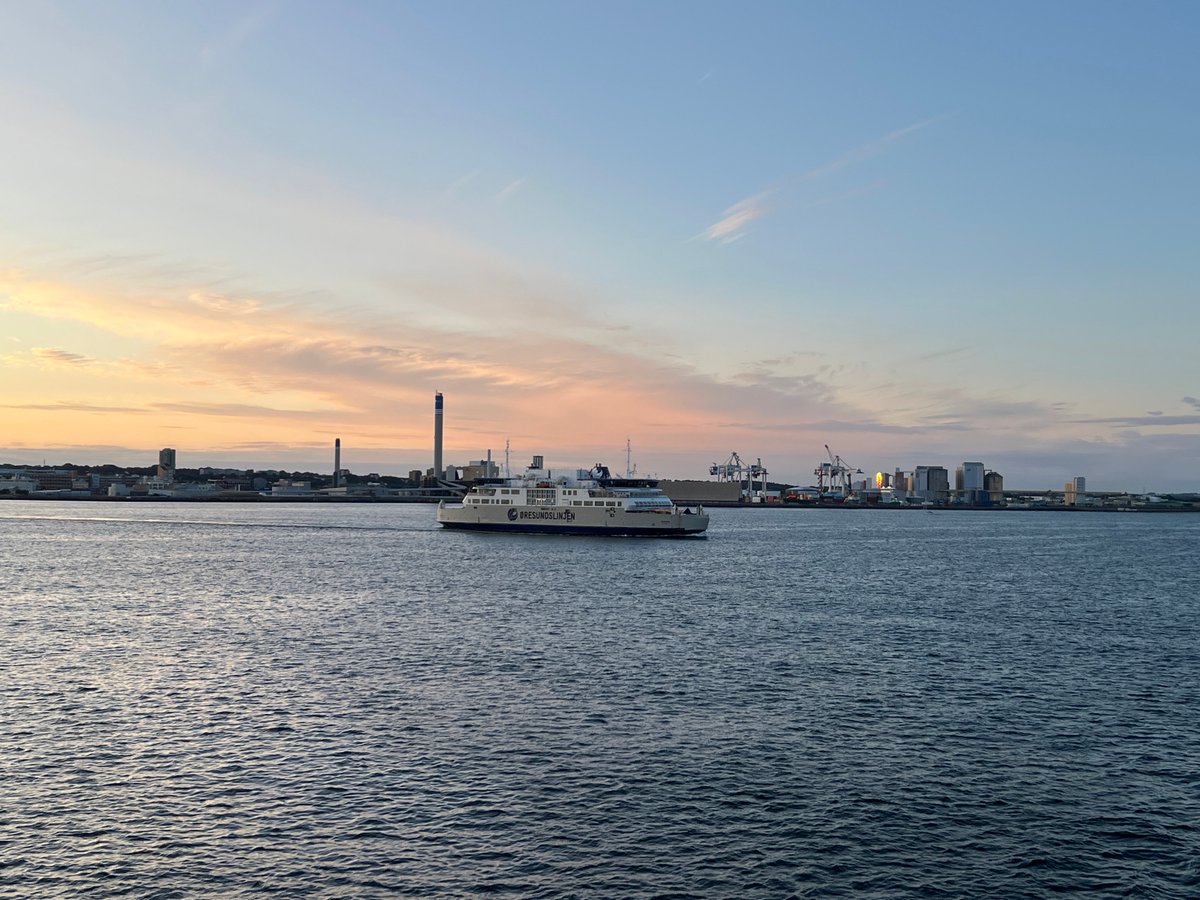 Öresundslinjen ferry crosses a calm Helsingborg strait at sunset