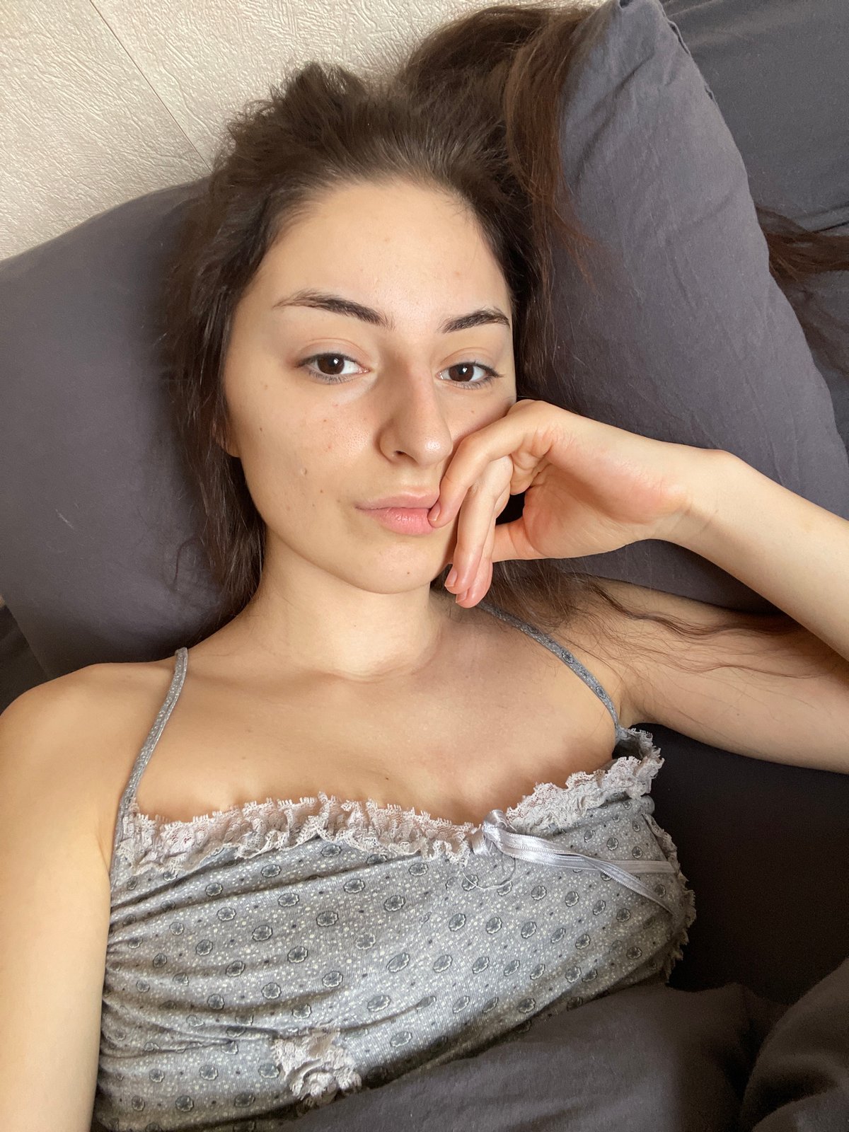 Morning scenes: woman in bed, cooking show on TV