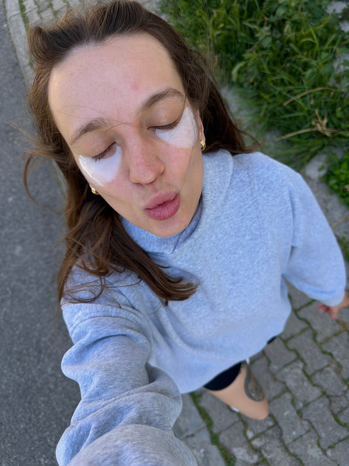 Woman films selfie content around Budva, Montenegro with dog