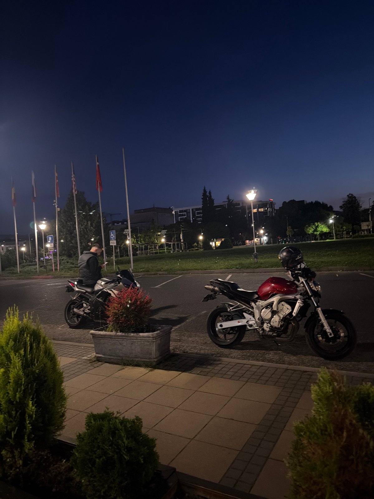 Two motorcycles parked on sidewalk in Kardzhali, Bulgaria