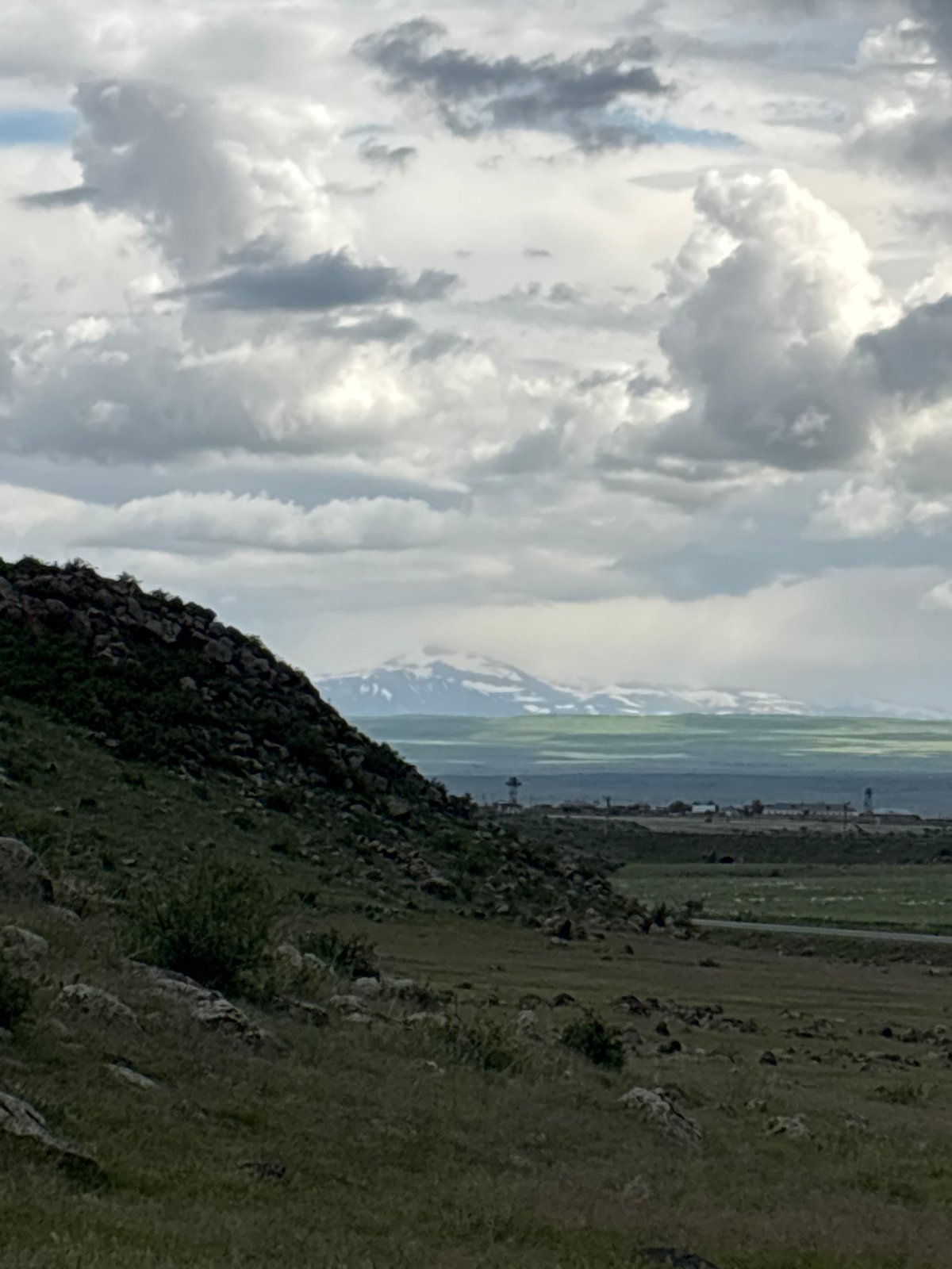 Group gathers at stone structure on Armenian hillside