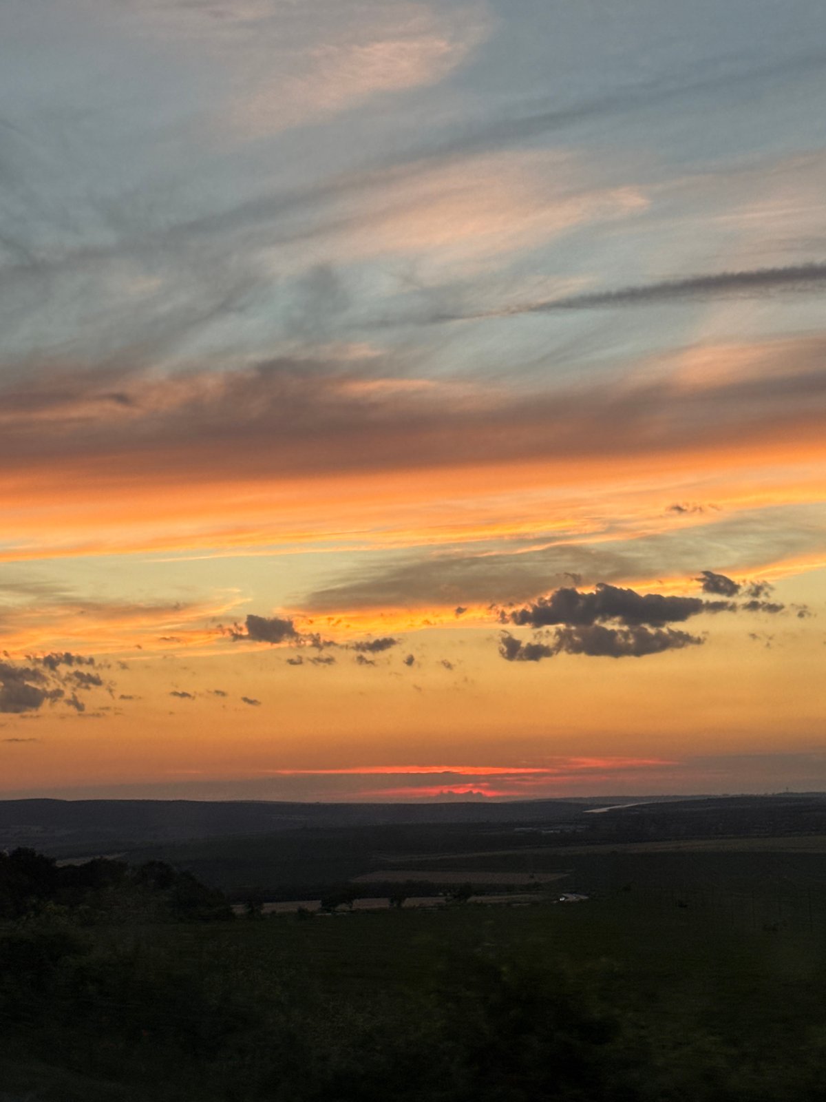 Vivid sunset clouds over rural Buinovo, Bulgaria