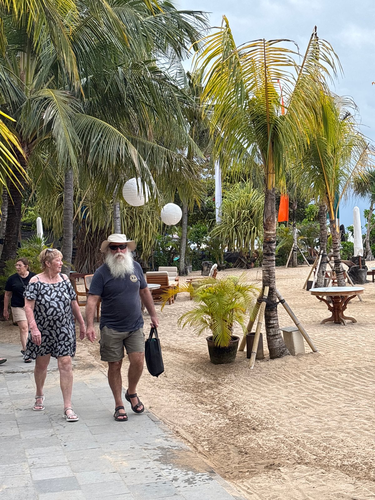 Morning beach walk activity observed in Denpasar, Indonesia