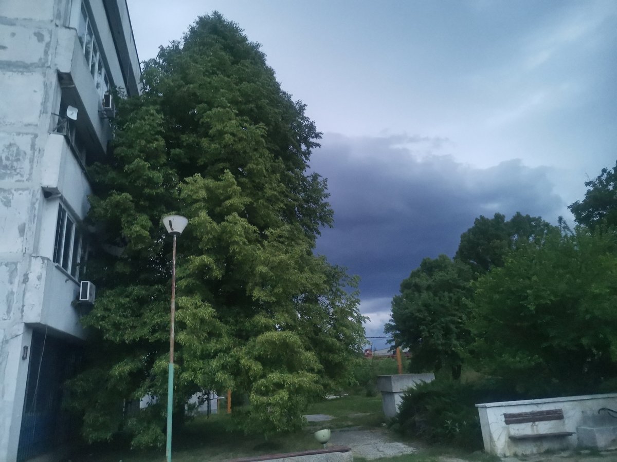 Storm clouds gather over rural Bulgarian village