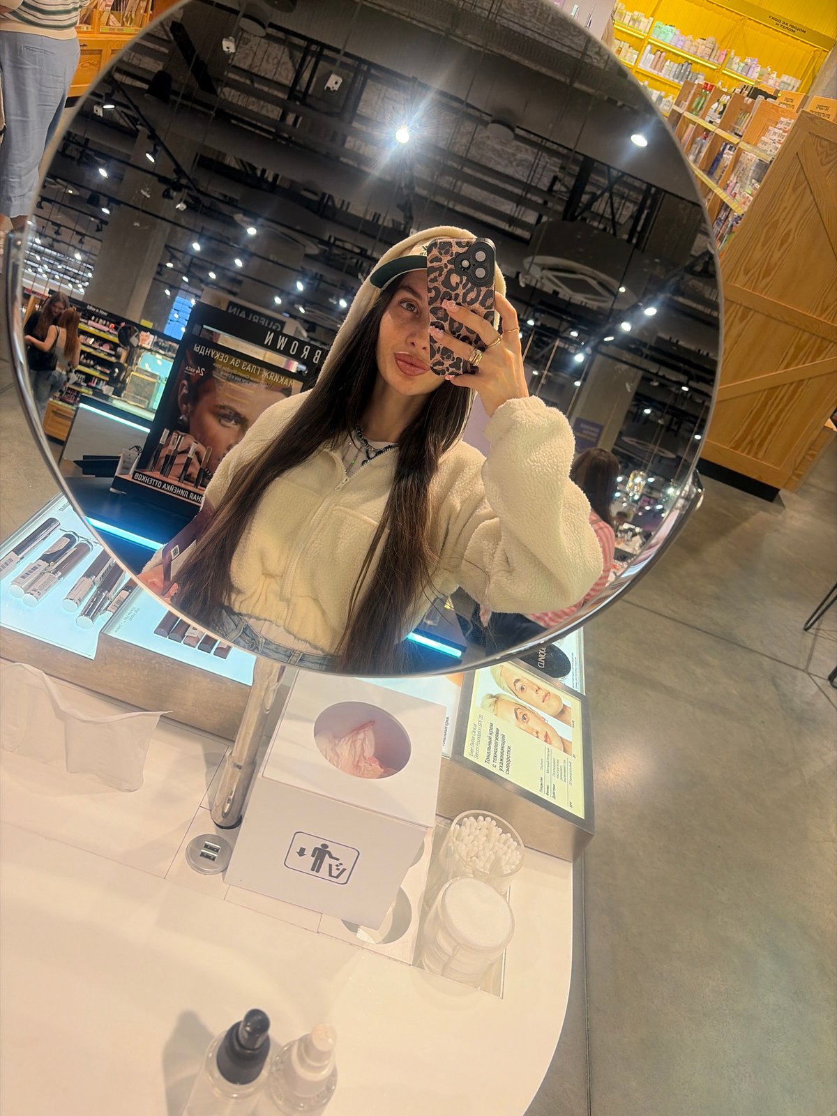 Woman shops cosmetics, takes selfies in Saint Petersburg store