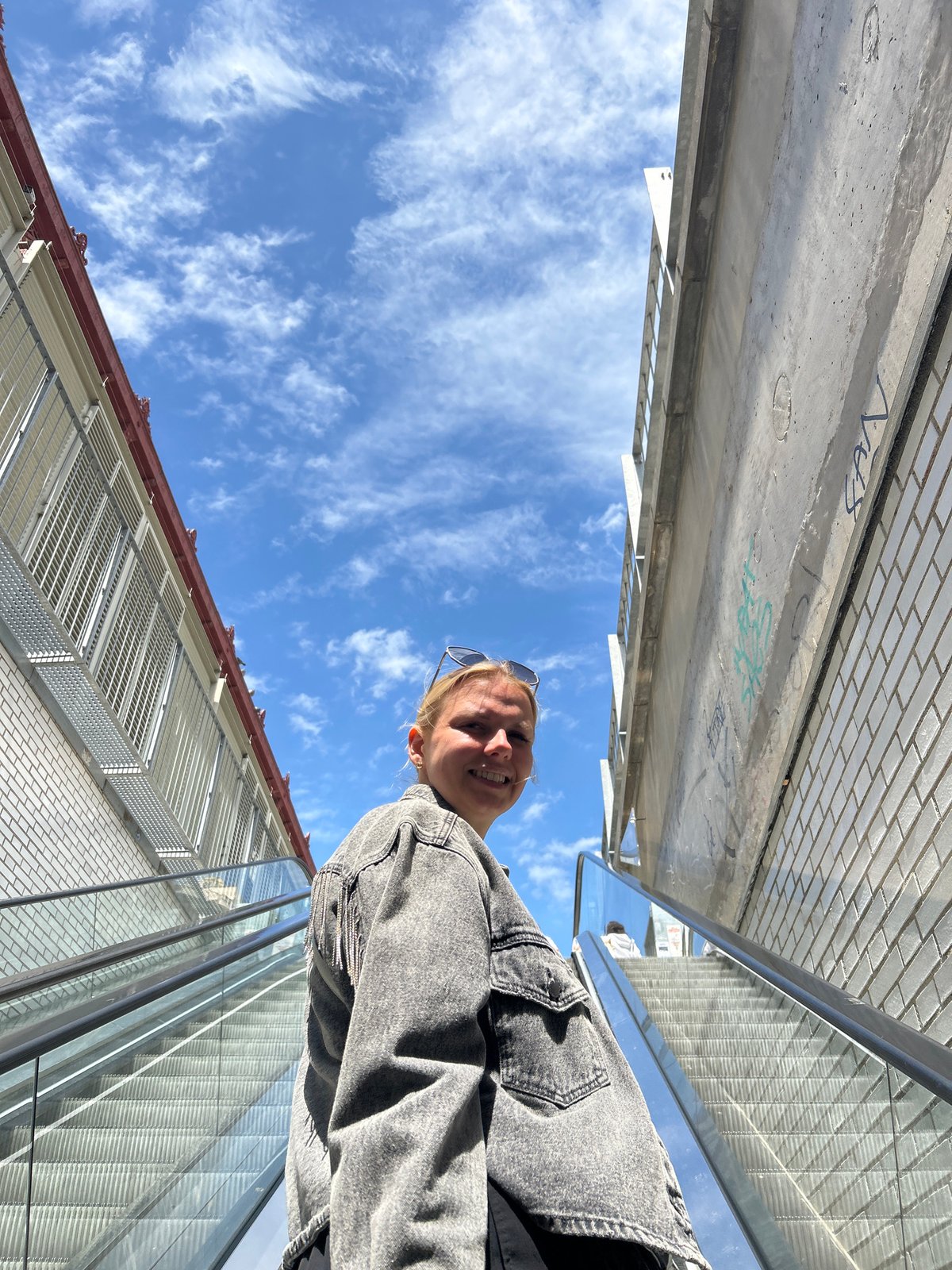 Barcelona residents document urban moments on pedestrian bridge, interior space