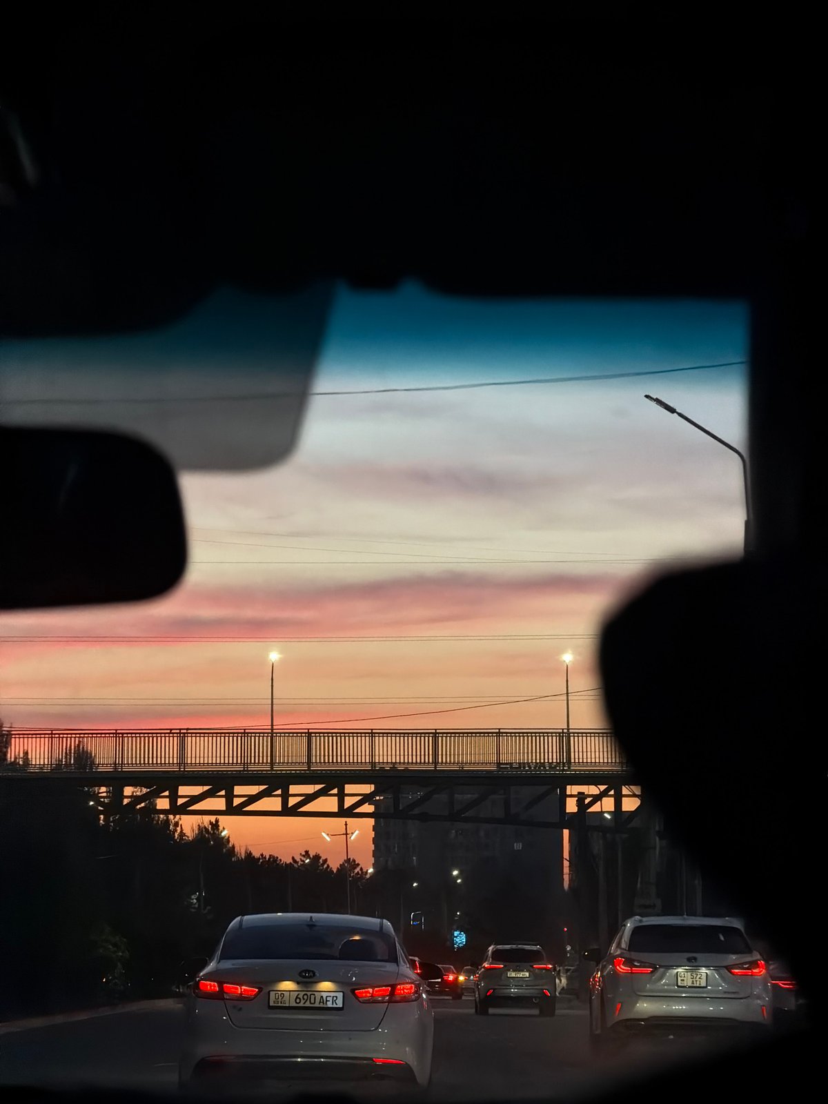 Driver captures street views during evening commute in Bishkek