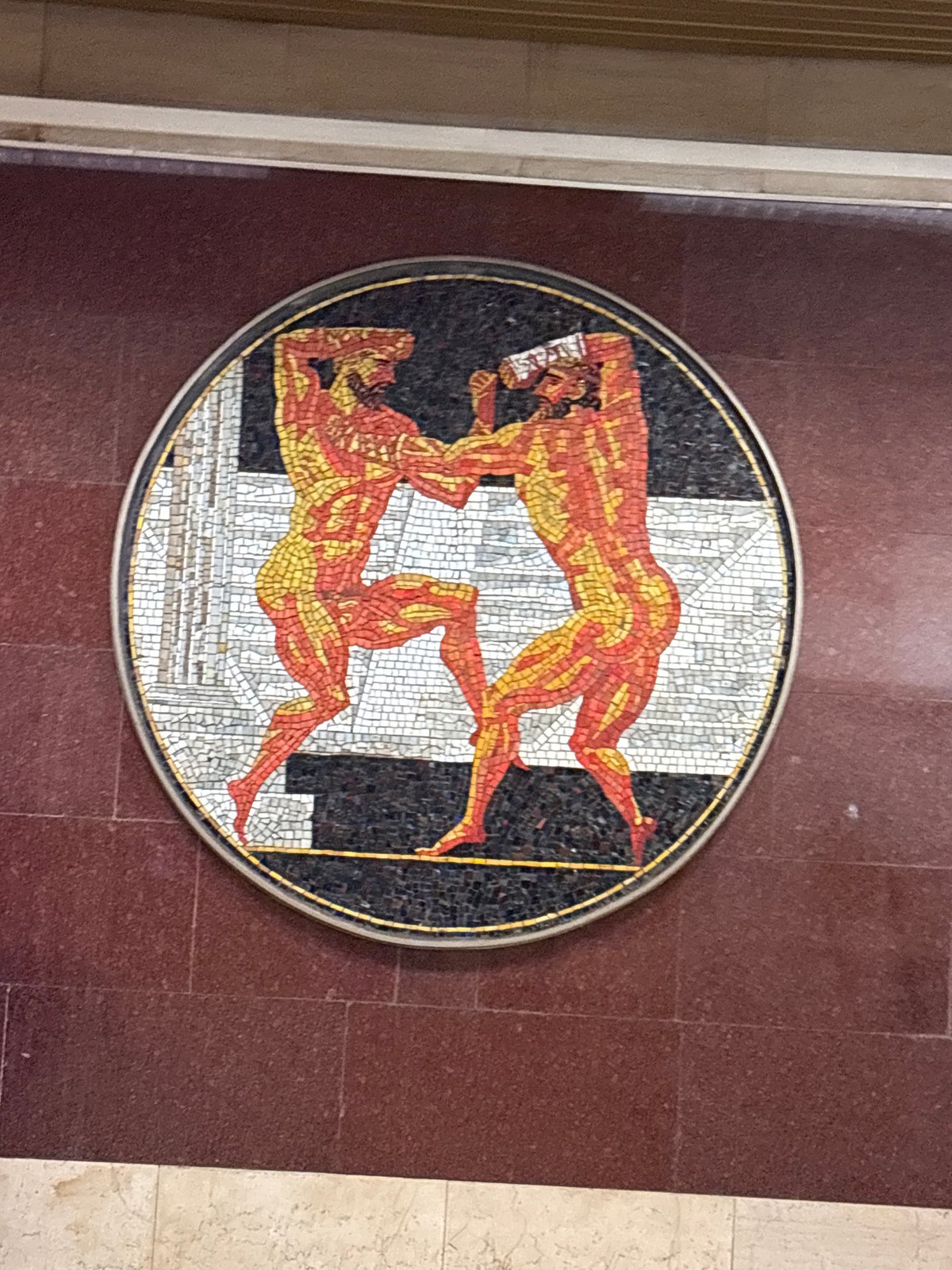 Metro station artwork and train arrival documented in Shushary