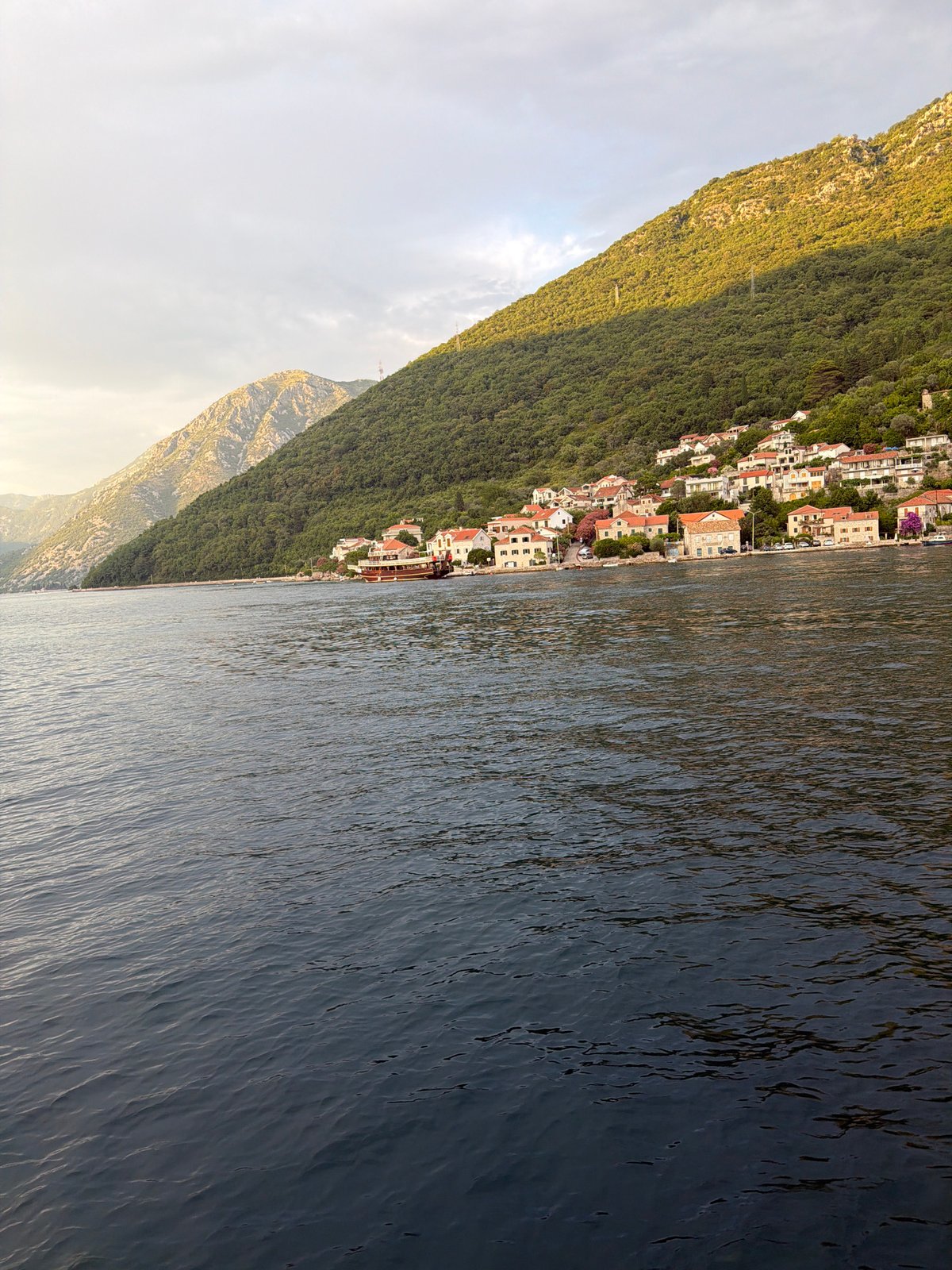 Lepetane ferry crossing the Bay of Kotor at evening