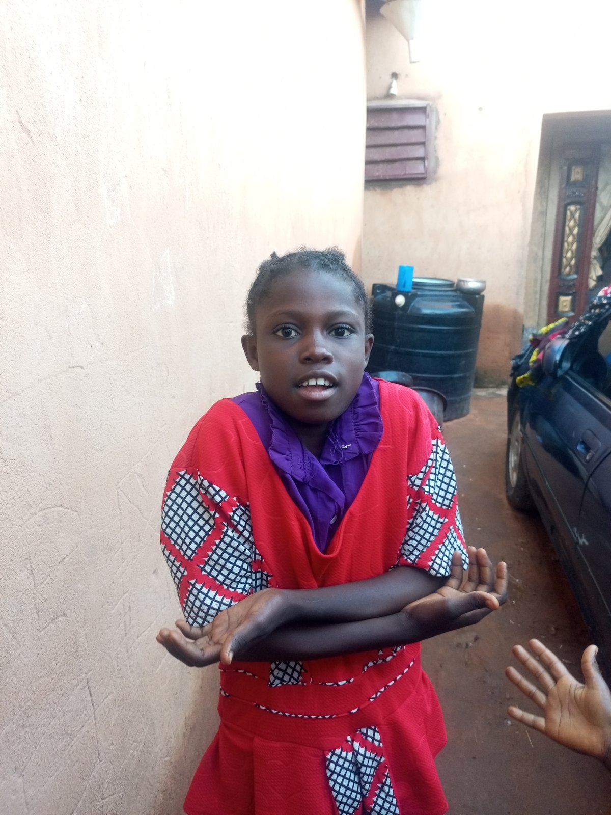 Morning street scenes with children and adults in Tempure, Nigeria