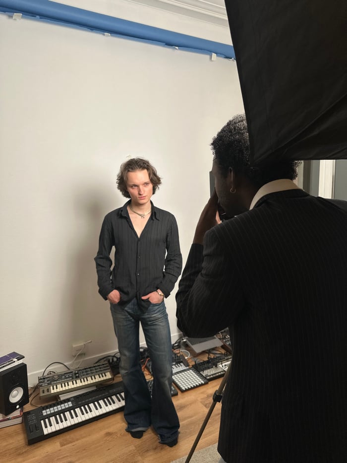 Photography session captures musicians and subject in studio setting
