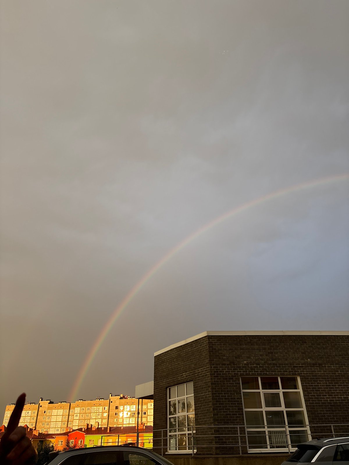 Double rainbow over Mikhaylovsk apartment blocks after summer rain