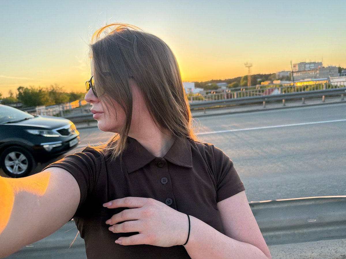 Woman captures sunset selfie session in Chaikovsky, Russia