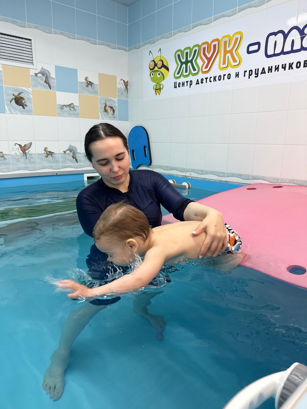 Swimming lesson observed between woman and child in Russia