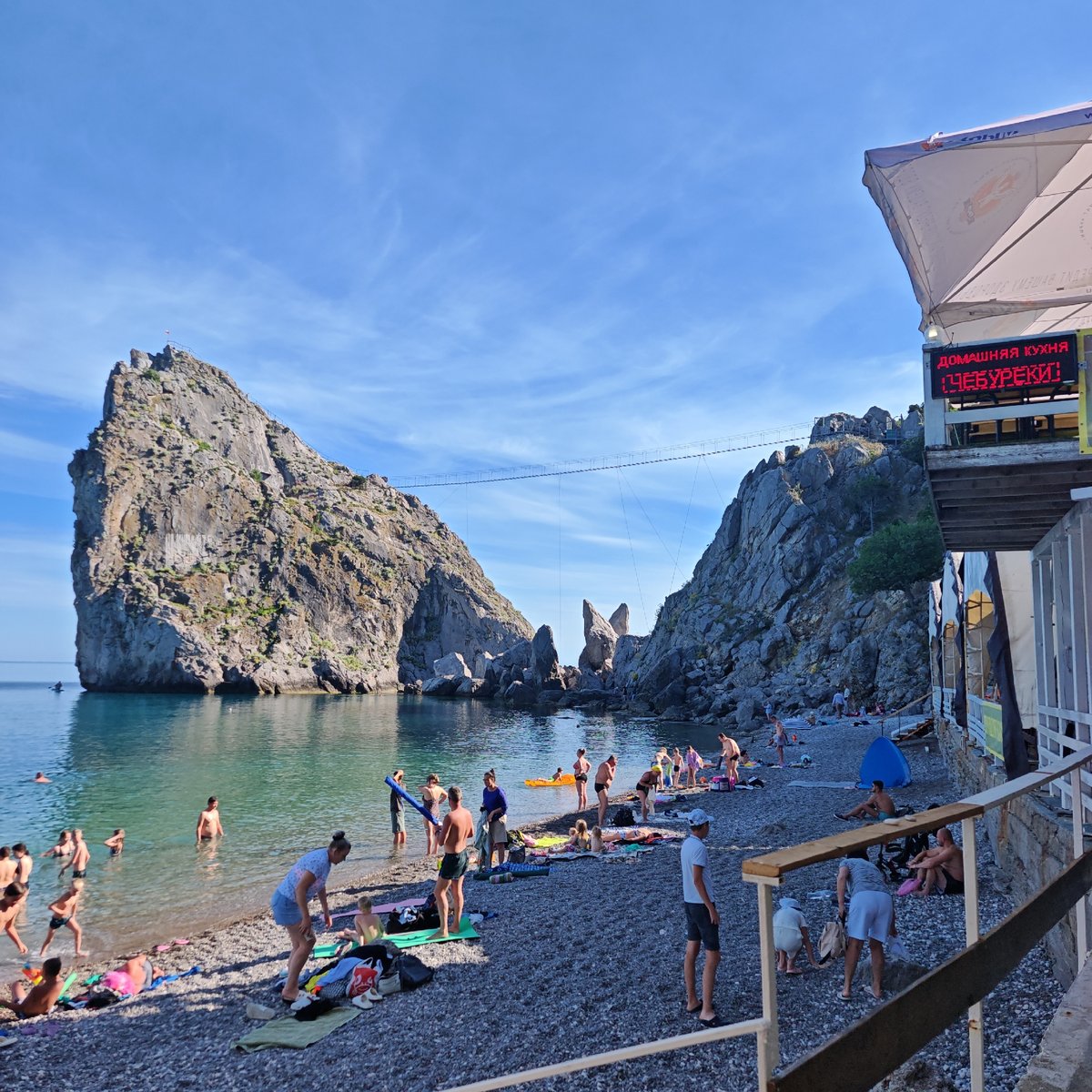 Summer crowds fill Simeiz beach on a clear Black Sea afternoon