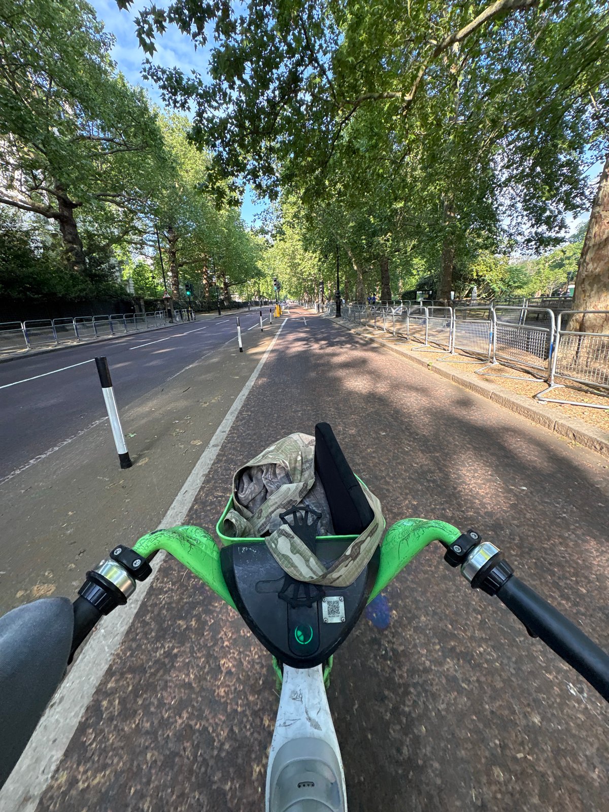 Morning e-scooter ride captured on tree-lined London street