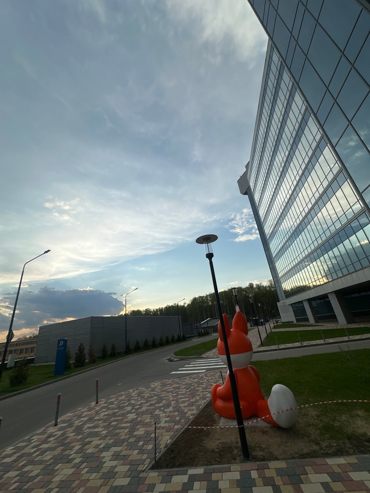 Orange fox sculpture spotted on Moscow street amid dramatic clouds