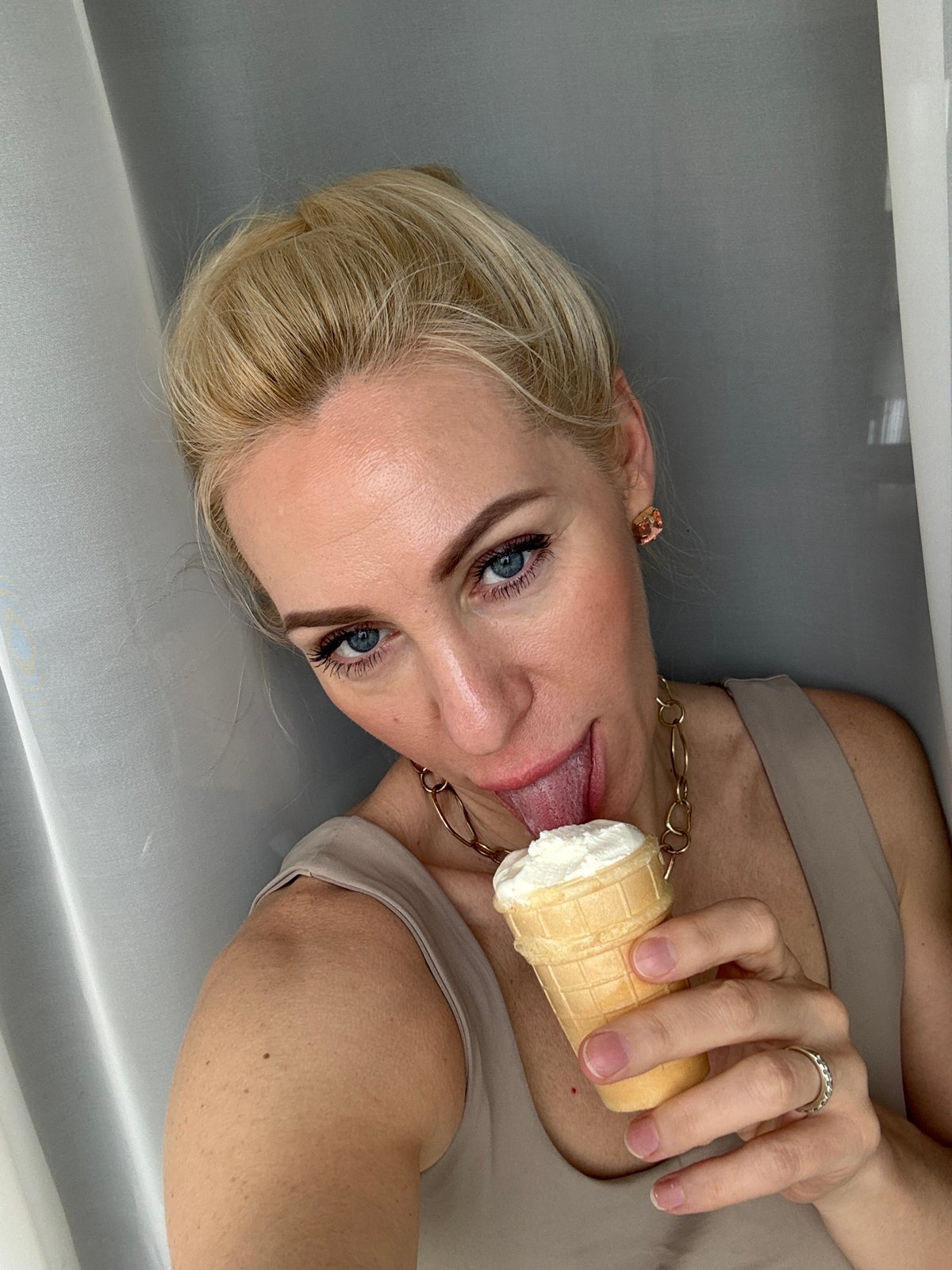 Woman enjoys ice cream during casual photo session in Russia