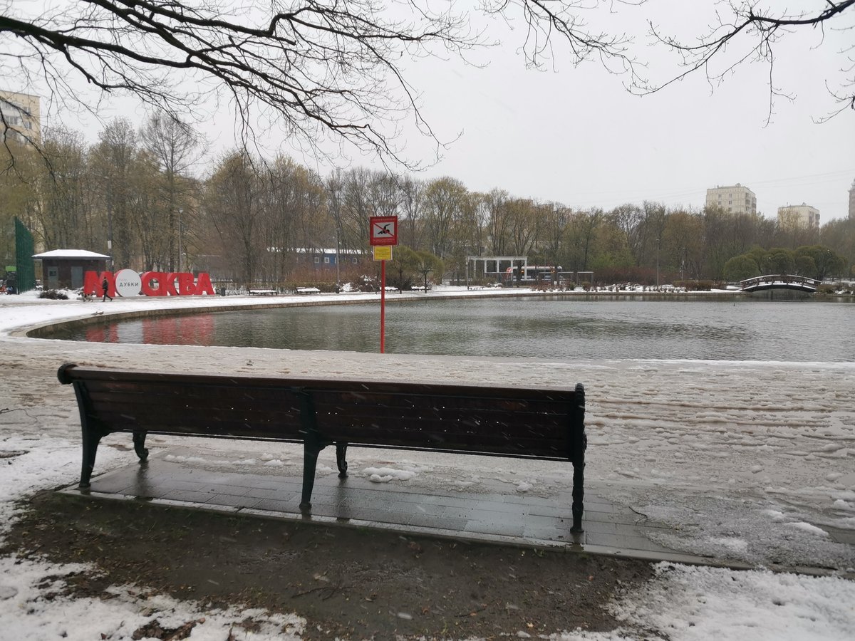 Moscow park scenes captured during snowy spring day