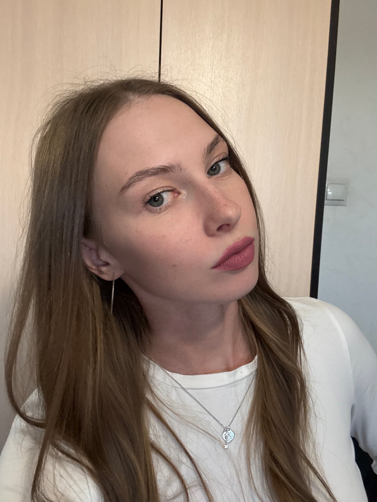 Selfie session in Perm, white top and silver jewelry throughout