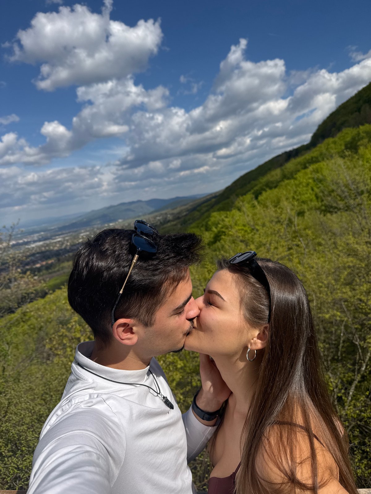 Couple shares romantic moments on Sofia scenic overlook platform