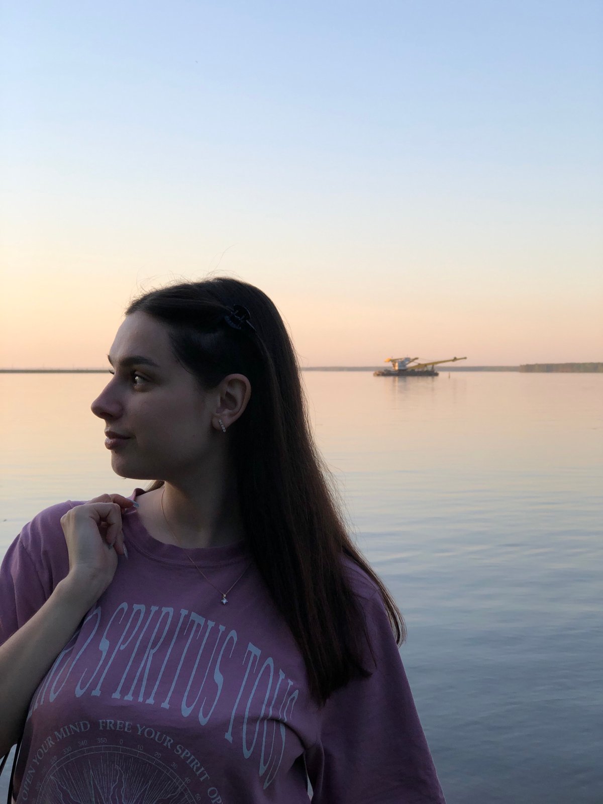 Woman photographed by water in Kizhi, Russia
