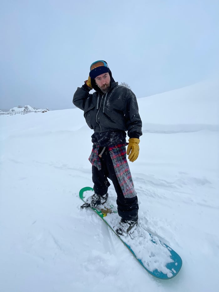 Snowboarder captured standing and lying in Montenegro mountain snow