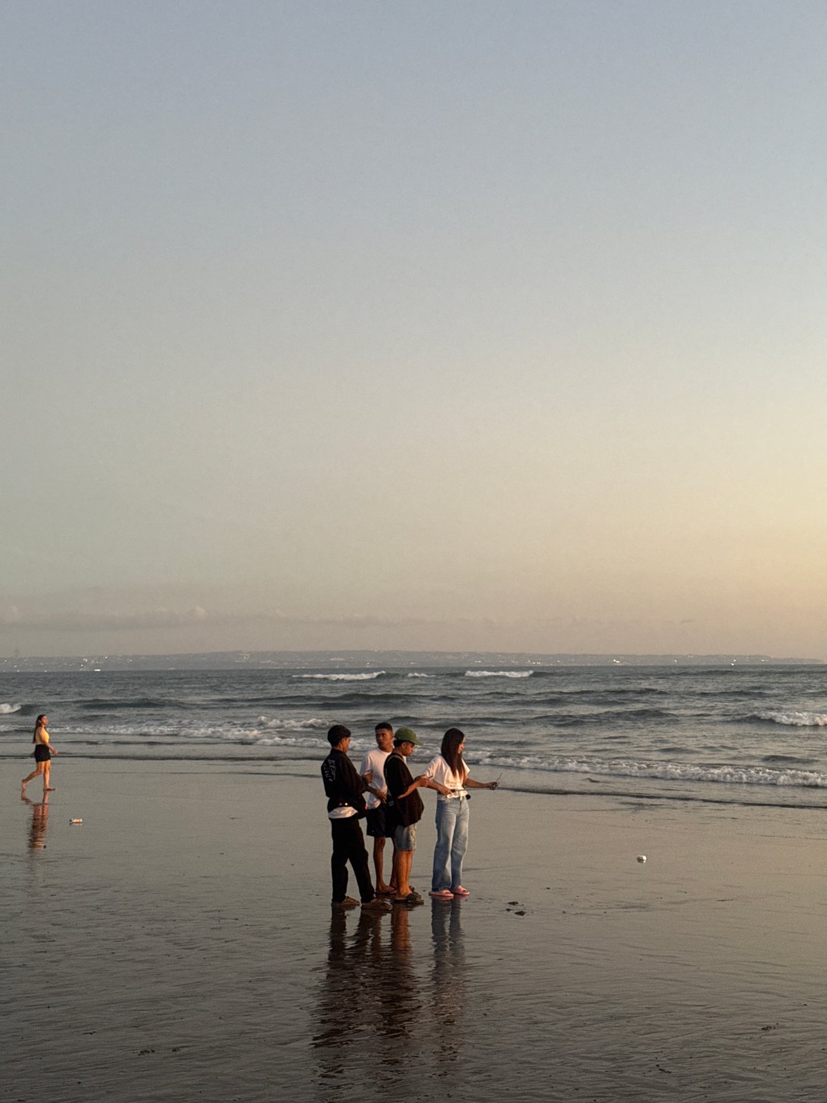 Sunset crowd gathers along North Kuta's shoreline