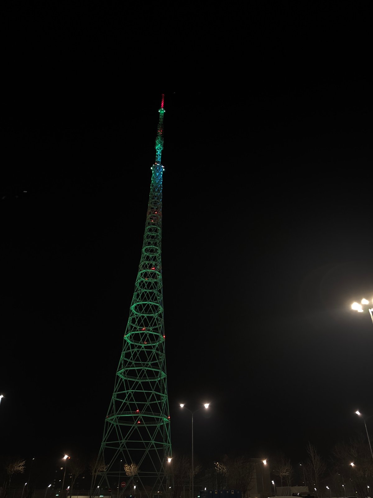 Perm Television Tower illuminated green at night in Russia