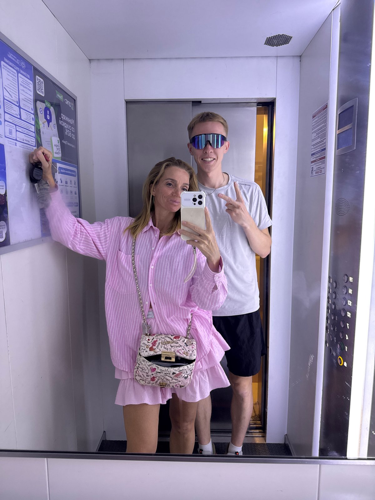 Two people take elevator selfie in Russia
