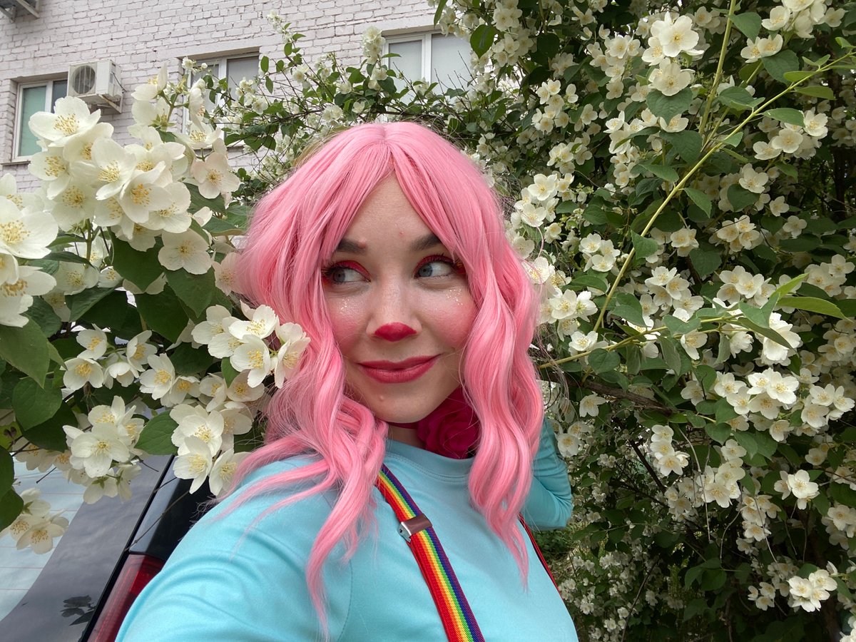 Clown makeup selfies beside jasmine flowers in Chaikovsky