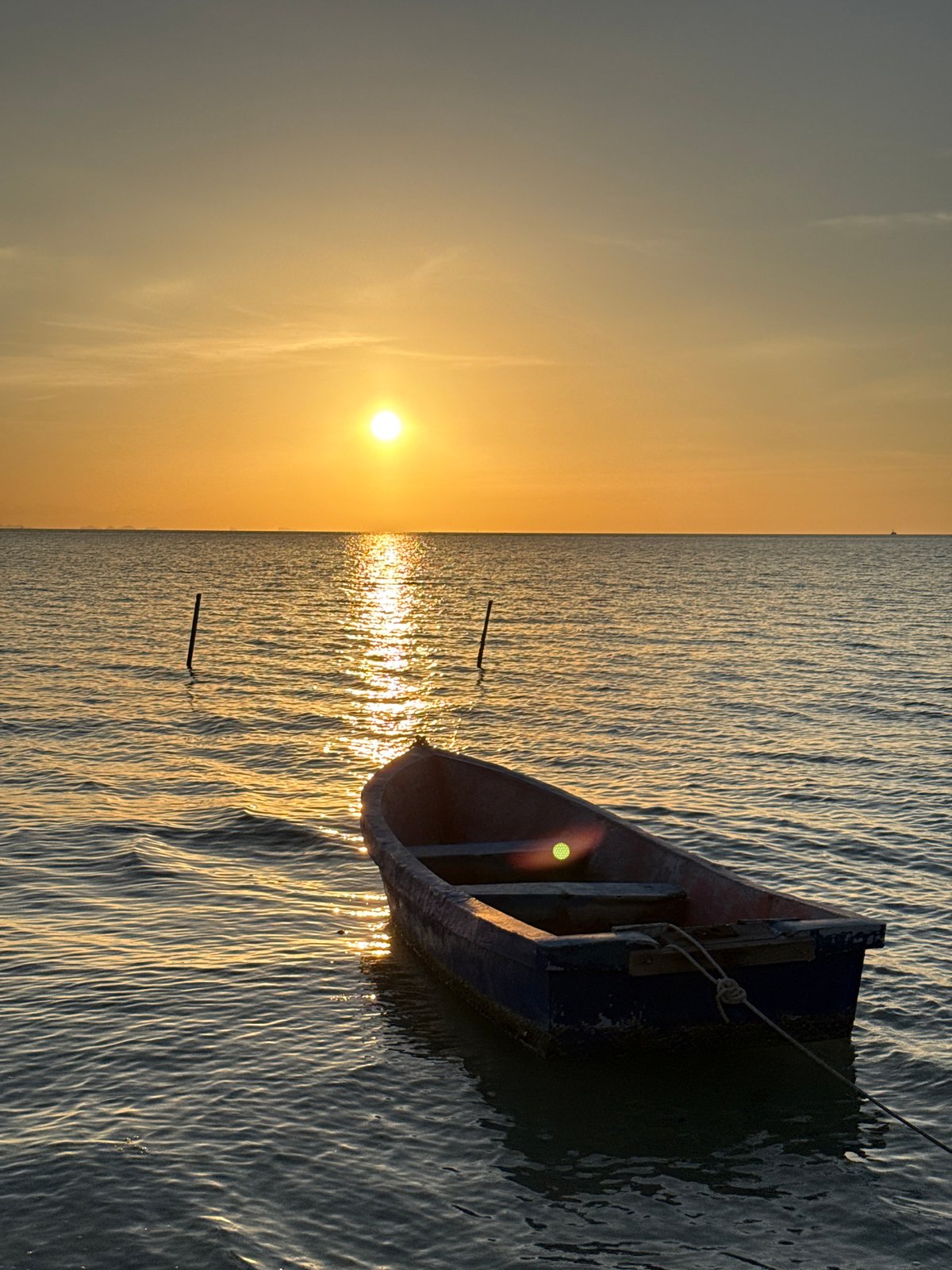 Tethered rowboat at sunset, Ko Samui waters