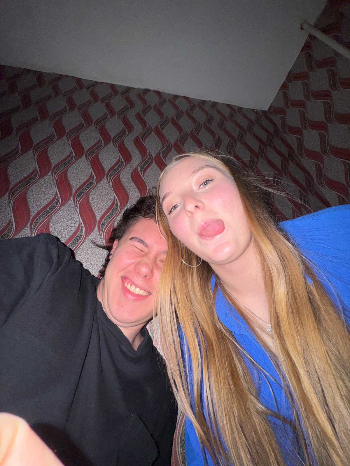Young couple takes playful selfies in Perm apartment