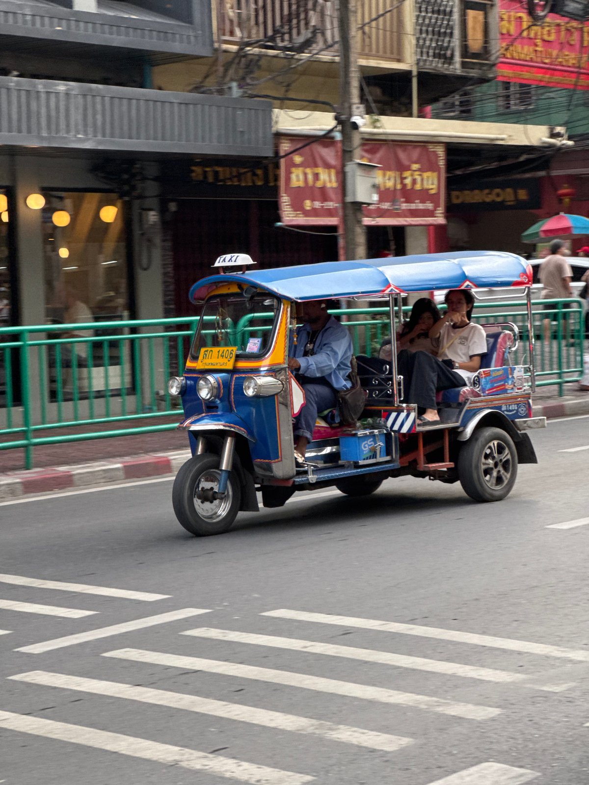 Tuk-tuks and street food on a busy Bangkok morning