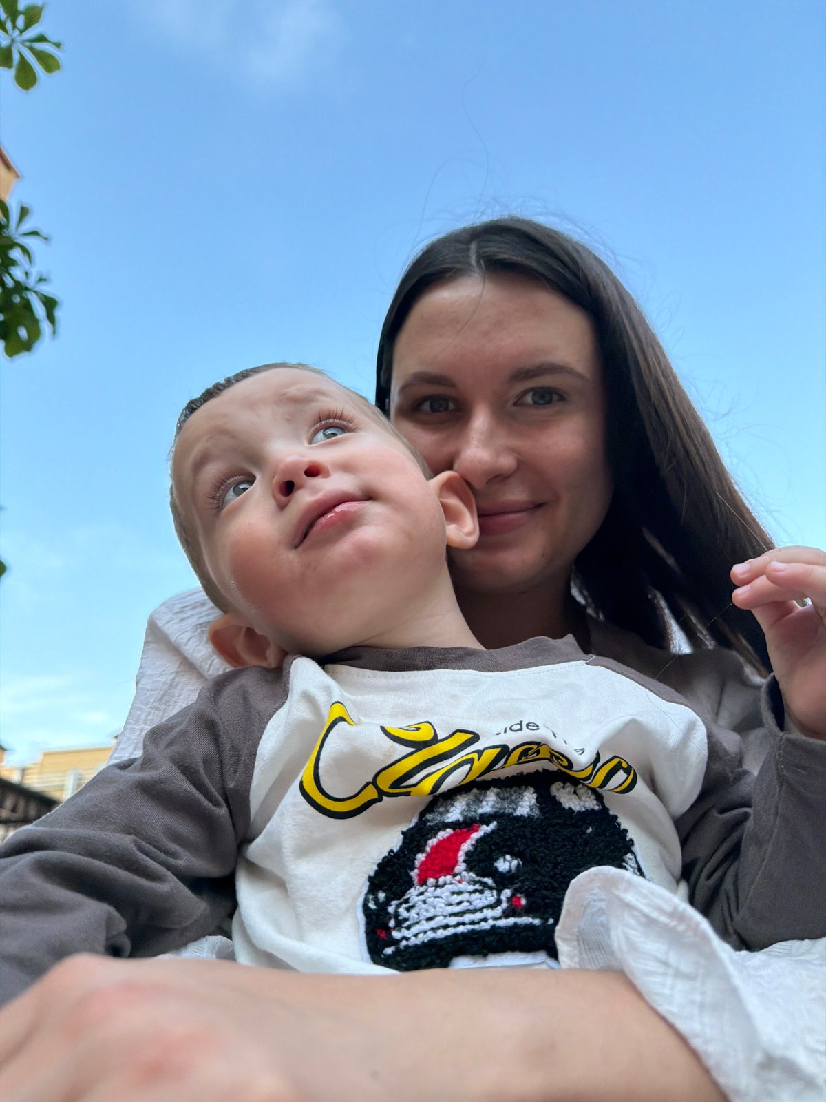 Children play at playground in Vniissok, woman with baby present