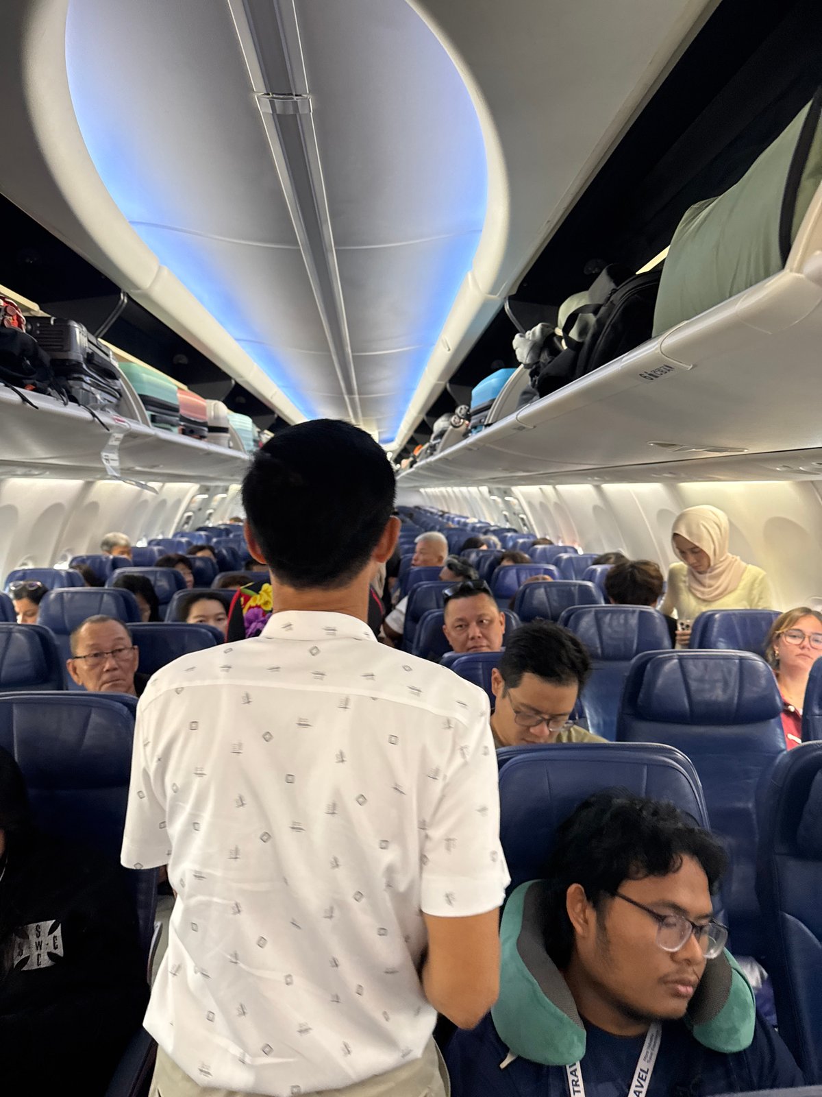 Morning departure from Hanoi's Noi Bai Airport, rain on the tarmac